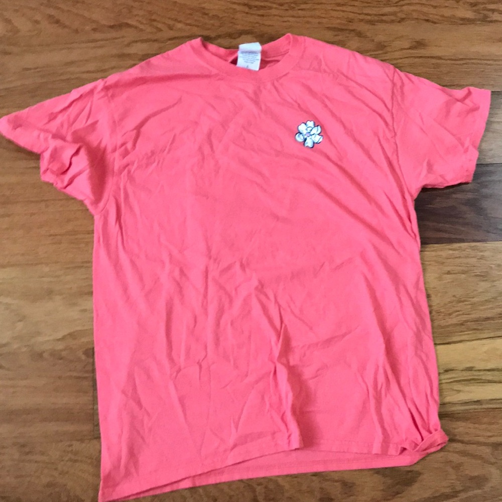 tee with a logo on the front and a big logo on bac